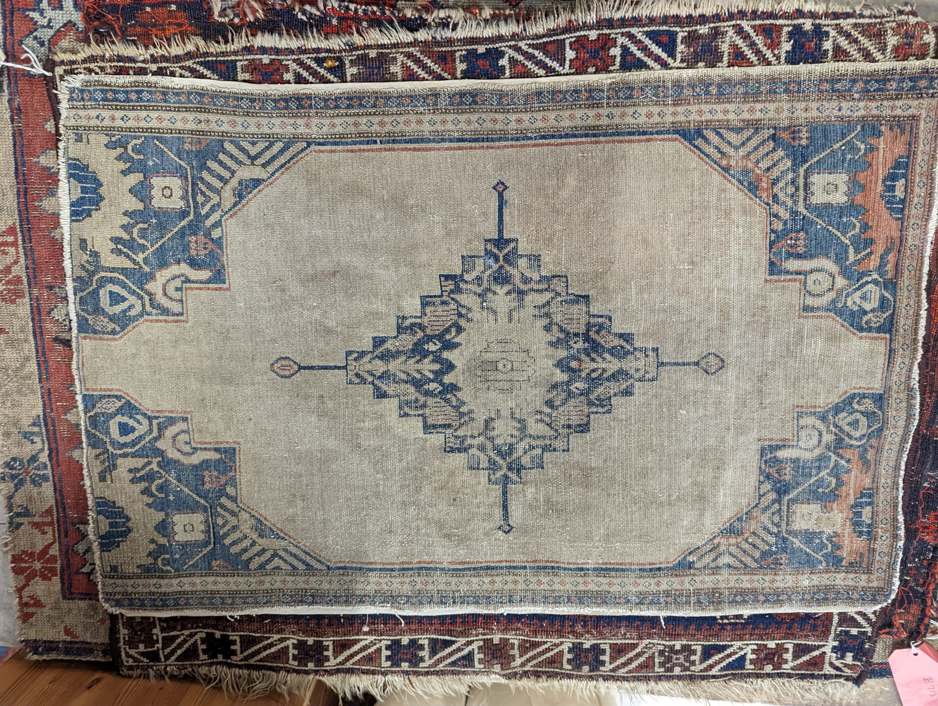 An antique Kuba rug, 118 x 84cm, a Kurdistan bag face, a Belouch bag face and two small rugs